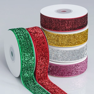 Sparkling glitter ribbon rolls in assorted metallic colors for gift wrapping and DIY decor