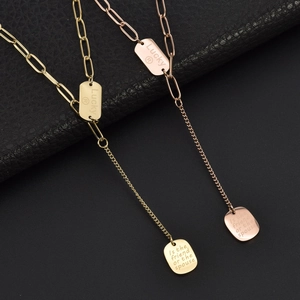 Titanium steel Y-shaped necklace with engraved Lucky oval charms in gold and rose gold