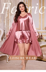 Detailed view of rose pink satin three-piece pajama set with silk-like finish and texture