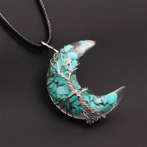 Detailed wire-wrapped tree of life moon pendant with turquoise stone on black cord