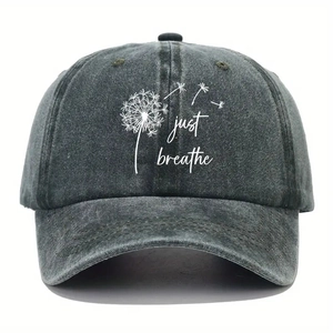 Close-up of dandelion print and just breathe text on washed cotton baseball cap