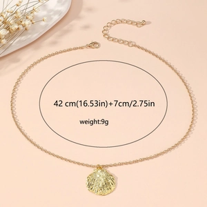Detail of gold seashell pendant necklace with 42cm length and 7cm extension specs