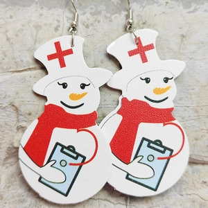 Detailed view of handmade nurse snowman faux leather earrings on stone background