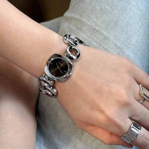 Women's square dial watch with irregular hollow silver chain strap on wrist