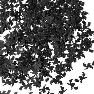 Close-up of black witch riding broom silhouette paper confetti for Halloween party decor