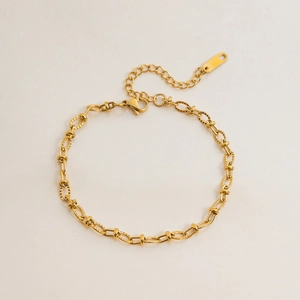 Detail of gold heart link bracelet with adjustable chain and lobster clasp closure