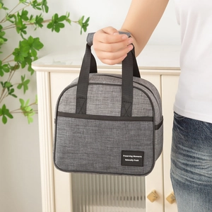 Gray insulated lunch bag with black handles and high-capacity cation fabric design