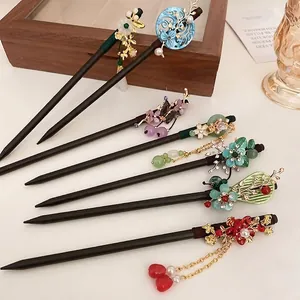 Vintage style wooden hairpins with pearl flower designs and traditional motifs
