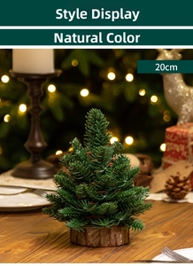 Detailed view of 20cm mini artificial Christmas tree with natural wood base on dining table