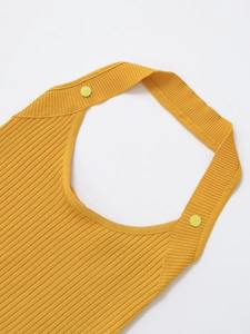 Detail shot of yellow knitted halter top showing neckline and fine fabric texture