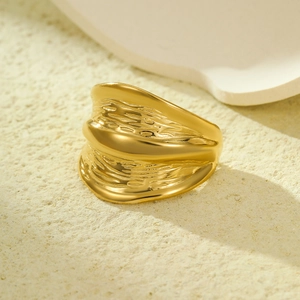 Golden stainless steel wide ring with irregular lava texture for women