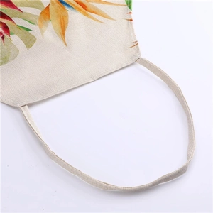 Close-up of durable linen fabric texture with vibrant tropical floral and leaf prints