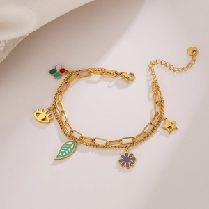 Gold double-layer chain bracelet featuring colorful enamel eye and clover charms