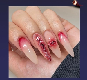 Macro view of long stiletto Halloween press-on nails with red wound stitch art design