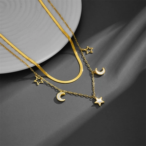 Double-layered gold stainless steel necklace with star, moon pendants and shell inlays