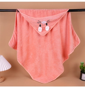 Close-up of orange hooded baby towel with cartoon rabbit embroidery and 3D ears