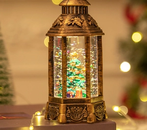Close-up of vintage bronze Christmas lantern with sparkling glitter and festive tree