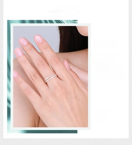 Detail of a minimalist double-layer S925 sterling silver ring with pavé-set zircons