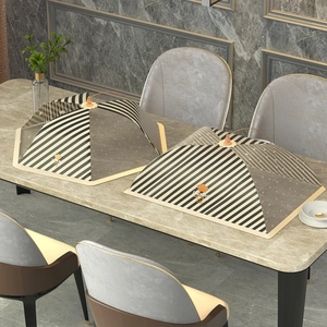 Foldable food cover with black and white stripes and gold handle for dining table