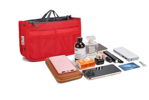 Red nylon handbag organizer insert with multiple compartments and daily essentials shown