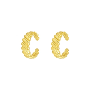 Detailed macro view of golden ribbed croissant ear cuffs with polished metallic finish