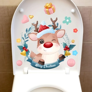 Detail of Christmas toilet sticker featuring a cute reindeer and Merry Christmas text