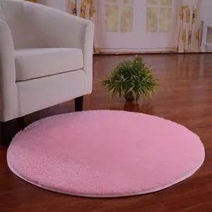 Pink round plush Nordic rug for bedroom or living room decoration on wooden floor
