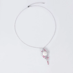Silver teardrop necklace featuring white pearl and pink gemstone on white background
