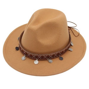 Detailed view of khaki wool felt fedora with ethnic woven band and silver metal charms