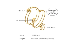 Detailed view of gold safety pin design bracelet and ring set with size measurements