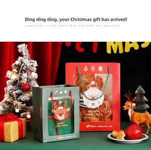 Christmas gift bags with transparent window showing plush toys and festive stationery