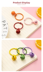 Close-up of heart cutout metal bells and colorful hinge rings for bags and keys