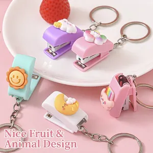 Mini pastel cartoon stapler keychain set with cute sun and cloud charms on a soft background