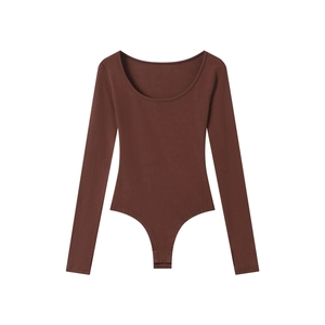 Detail of deep brown ribbed knit bodysuit showing the U-neck and long sleeve texture