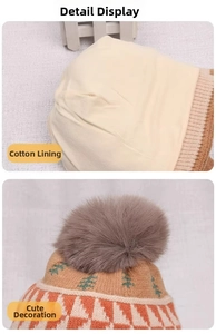 Detail view of cotton lining and jacquard tree pattern on kids winter knit hat