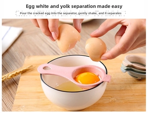 Pink egg separator in spoon shape for quick yolk and white separation on a white bowl