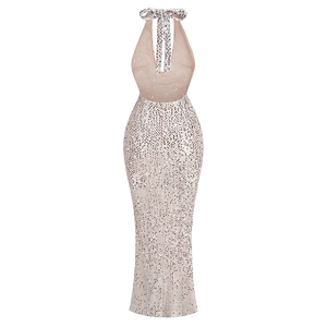 Detail of sequined halter neck evening dress showing backless cut and fishtail fit
