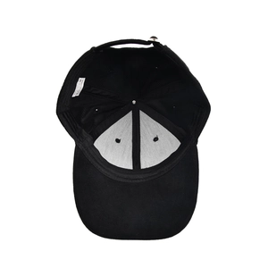Internal view of black cotton baseball cap showing white support lining and adjustable strap