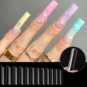 Detailed view of extra long clear C-curve nail tips with hand-painted cloud patterns