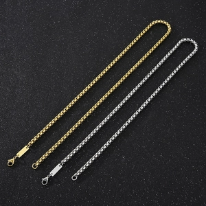 Detail of gold and silver square pearl chains with lobster clasps and blank metal tags