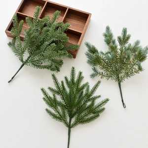 Artificial Christmas pine needles in three green shades for festive wreaths and DIY crafts