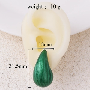 Green enamel teardrop earring on model with dimensions 18mm by 31.5mm and 10g weight
