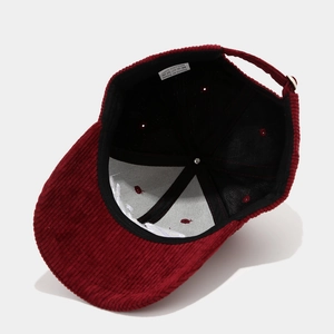 Deep red corduroy baseball cap with 100 percent cotton embroidery and adjustable strap