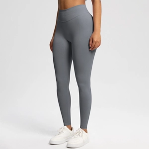 Detail of high-waisted seamless yoga leggings in dark grey featuring breathable knit texture