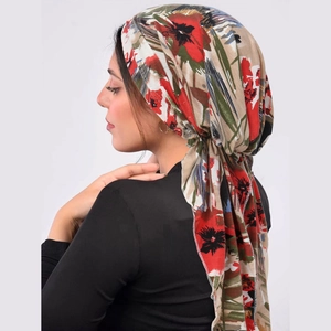 Floral printed turban hat for women with red and green flower pattern and tied tail