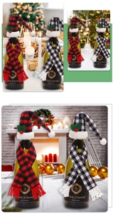 Plaid Christmas wine bottle covers with mini hats and scarves on festive table