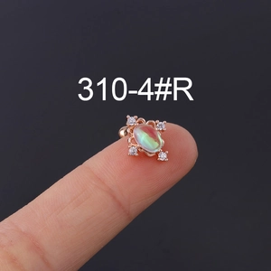 Rose gold moonstone ear stud with oval opal and white cubic zirconia on a fingertip