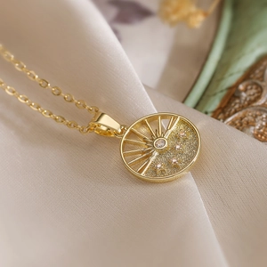Elegant gold-plated geometric round pendant necklace with sunburst sun and star motifs