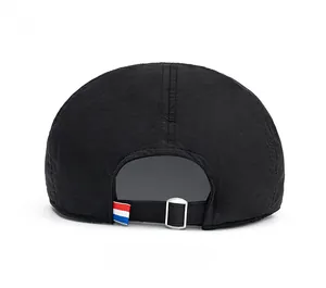 Detail view of quick-dry thin black beret hat with adjustable strap and metal buckle