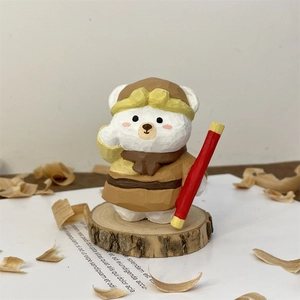 Handcrafted wooden polar bear figurine with pilot hat and scarf on a wood base